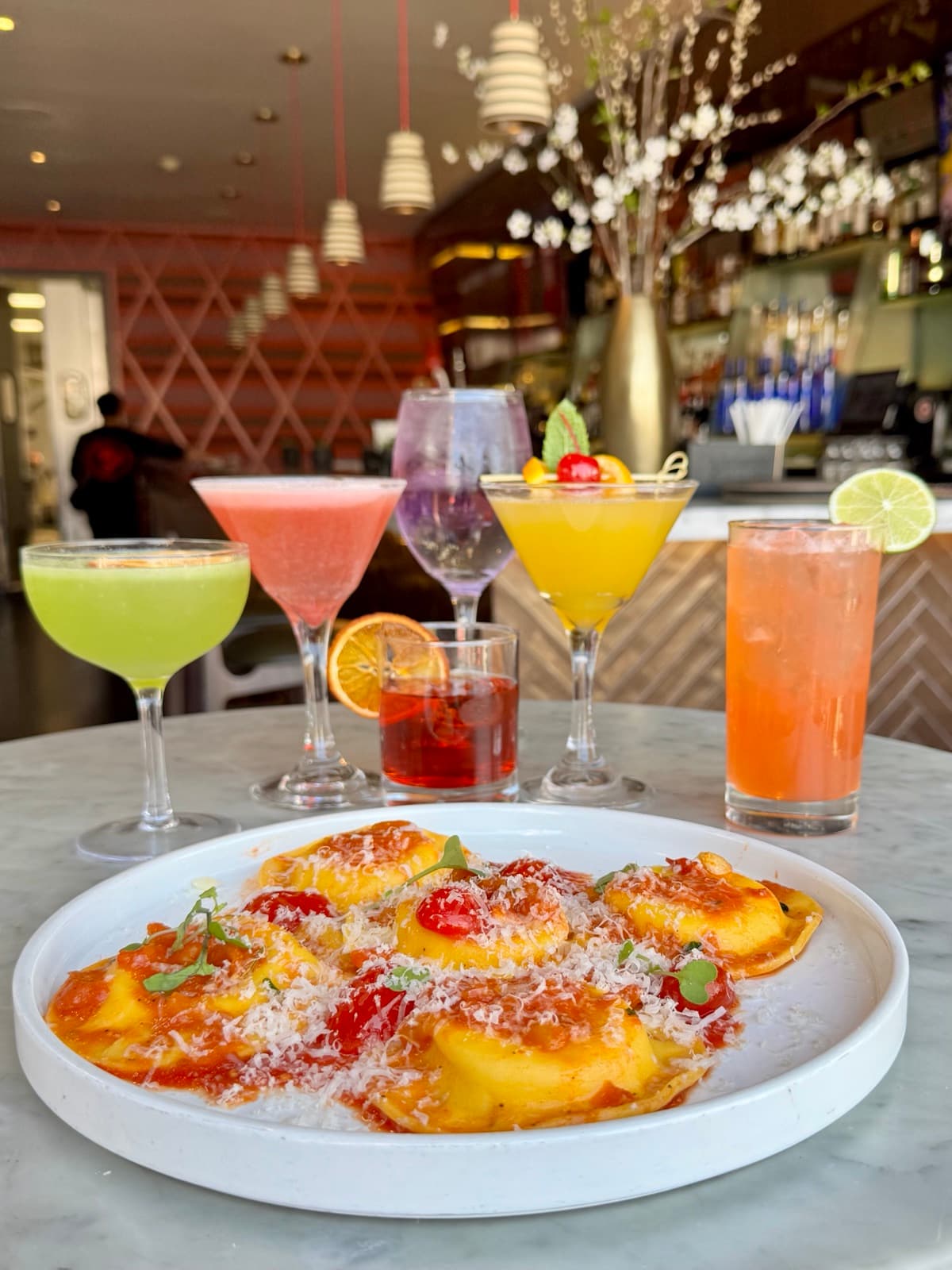 Burrata ravioli with colorful cocktails