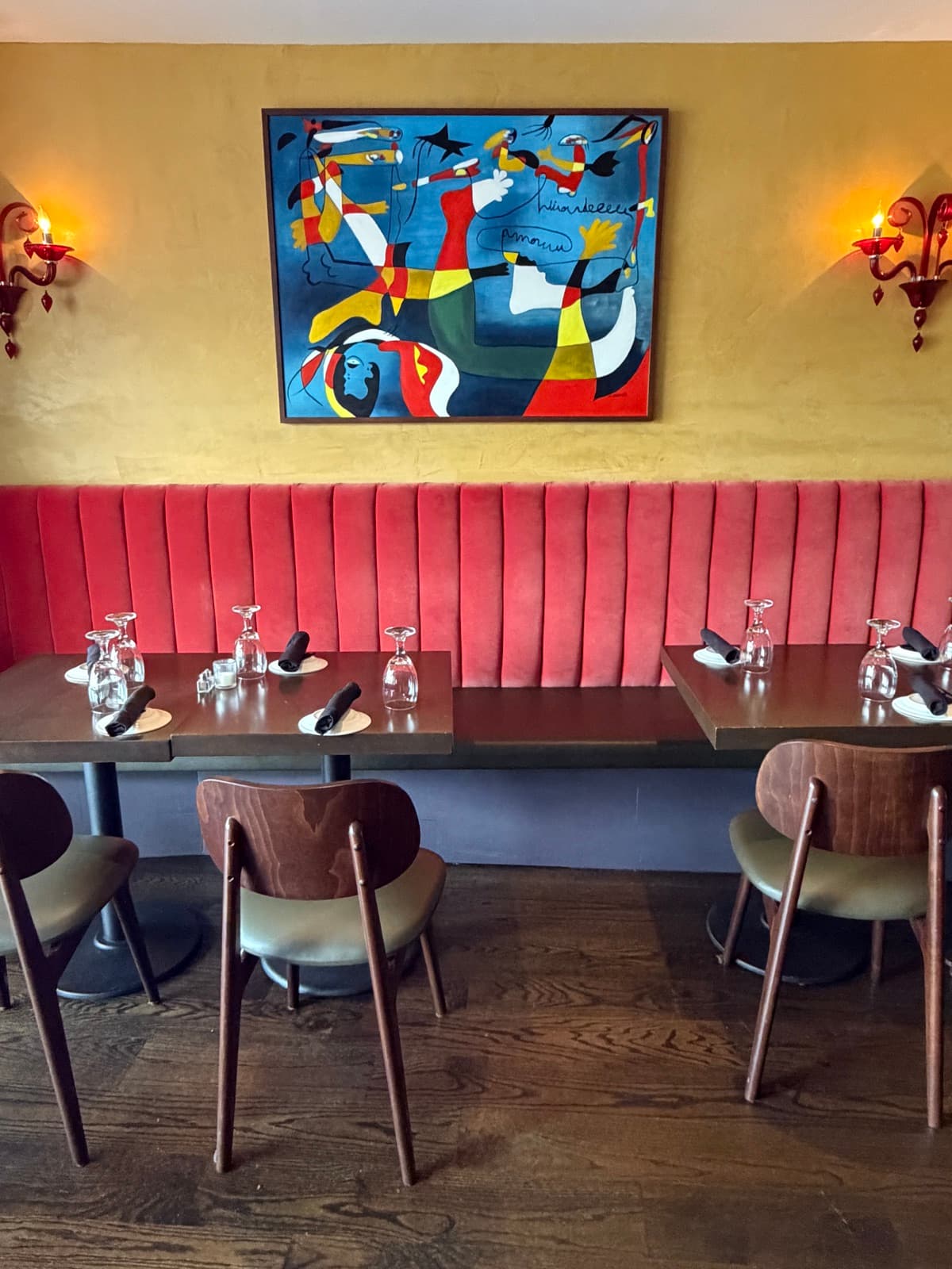 Restaurant interior with art and velvet seating